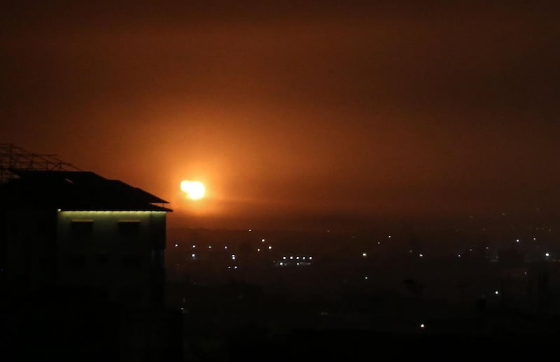 A picture taken in Rafah in the southern Gaza Strip, on April 16, 2021, shows an explosion following an airstrike by Israel. The Israeli army claimed that the Palestinians fired a rocket from the Gaza Strip into southern Israel, with no fatalities. / AFP / SAID KHATIB
