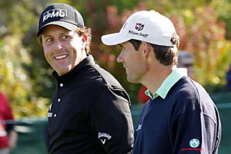 Phil Mickelson chats with Padraig Harrington during their first round of the US Open at Pebble Beach yesterday.