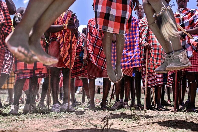 Men from the Maasai tribe in Kenya perform a traditional jumping ritual, a rite of passage to mark their transition from the warrior age-set to cultural junior elder. AFP