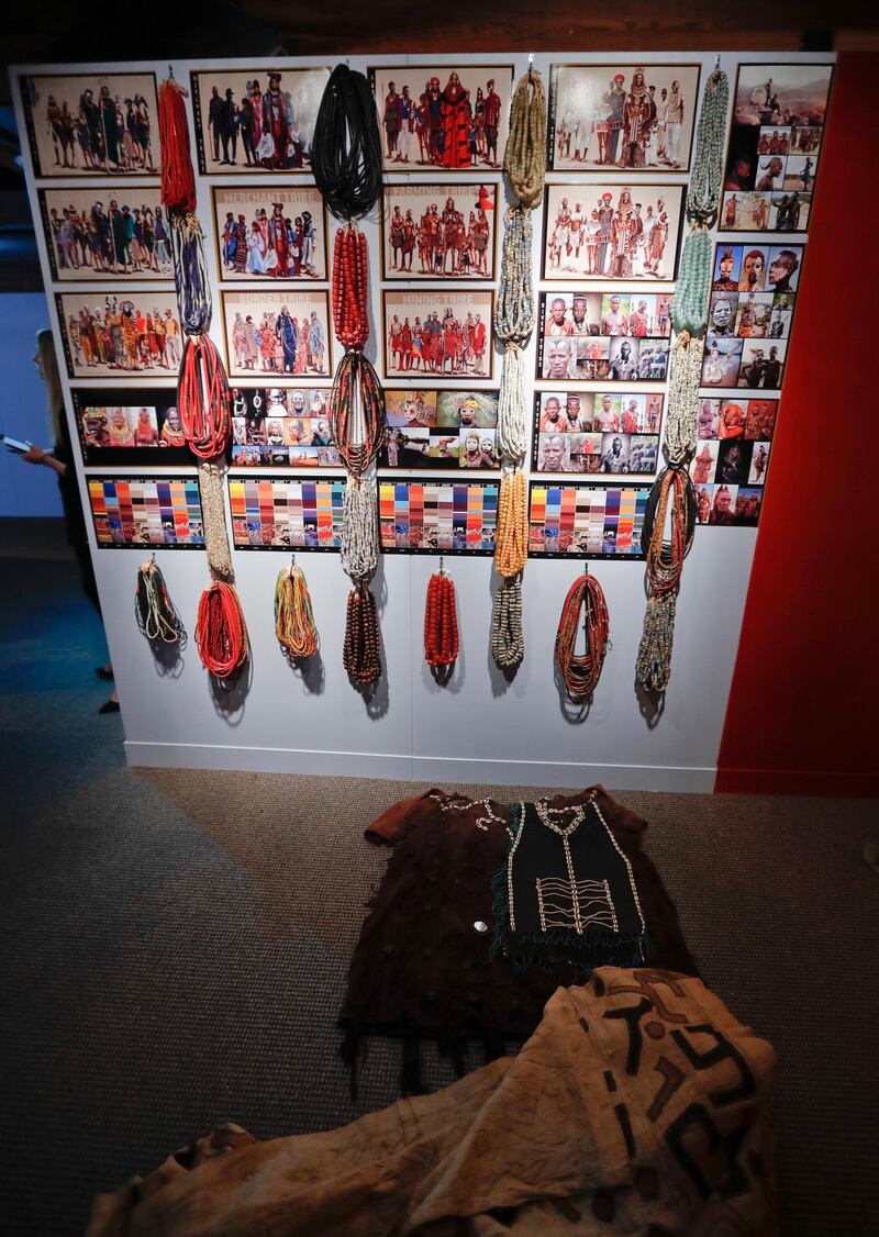 In this photo made on Thursday, Aug. 23, 2018, a display of drawings and beads used for costumes for the film "Black Panther" is seen during the installation of an exhibit of Ruth E. Carter cinematic costumes at Pittsburgh's Senator John Heinz History Center in Pittsburgh. The exhibit that opens Saturday, Aug. 25, explores Carter's groundbreaking career. "Heroes & Sheroes: The Art and Influence of Ruth E. Carter in Black Cinema" showcases over 40 costumes from nine movies. The costumes include those from "Amistad," "What's Love Got to do With It," "The Butler," "Malcolm X," "Selma," "Do the Right Thing" and of course "Black Panther." It is scheduled to run to Dec. 2, 2018. (AP Photo/Keith Srakocic)