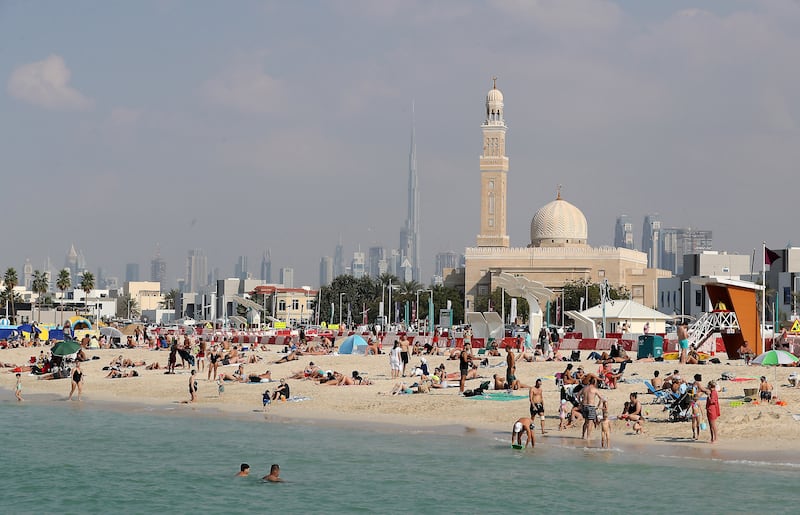 People enjoy the mild weather at Kite Beach in Dubai. Pawan Singh / The National