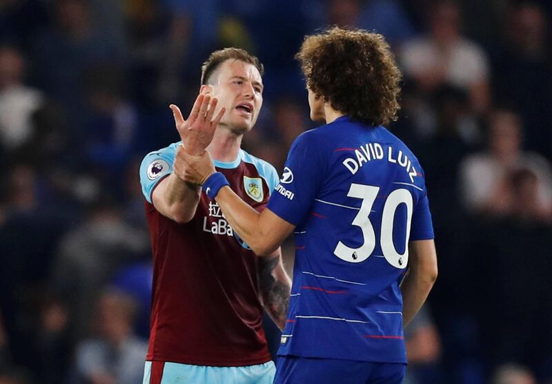 Chelsea's David Luiz, right, and Burnley's Ashley Barnes speak after Monday's match at Stamford Bridge where the Blues were held to a 2-2 draw. Reuters