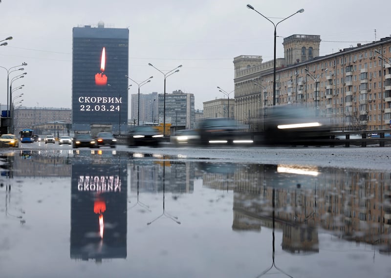 An electronic screen displays the message 'We mourn' in memory of the victims of the shooting attack, in Moscow. Reuters