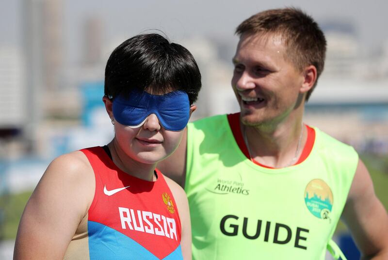 DUBAI, UNITED ARAB EMIRATES , Nov 7  – 2019 :- Alina Samigulina (RUS) with her guide participating in the women’s 400m T11 round 1 heat during the Dubai 2019 World Para Athletics Championship held at Dubai Club For People Of Determination in Dubai. ( Pawan Singh / The National )  For New. Story by Ramola