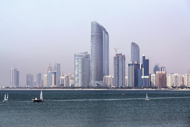 The Landmark skyscraper, center, stands on the city skyline beside a waterway in Abu Dhabi, United Arab Emirates, on Monday, May 30, 2016. Abu Dhabi, which sits on six percent of global oil reserves, cut spending by a fifth in 2015 and plans a further 17 percent reduction this year, according to the governments bond prospectus. Photographer: Alex Atack/Bloomberg