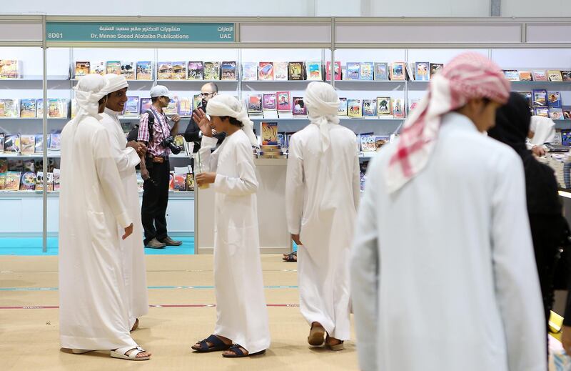ABU DHABI , UNITED ARAB EMIRATES – May 2 , 2017 : School students looking books at different book stalls during the Abu Dhabi International Book Fair held at Abu Dhabi National Exhibition Centre in Abu Dhabi.  ( Pawan Singh / The National ) For News. Story by Roberta Pennington. ID : 54280 *** Local Caption ***  PS0205- BOOK FAIR26.jpg