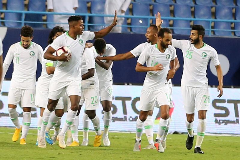 Saudi Arabia players celebrate Abdulaziz Al Bishi's 94th-minute opener. EPA