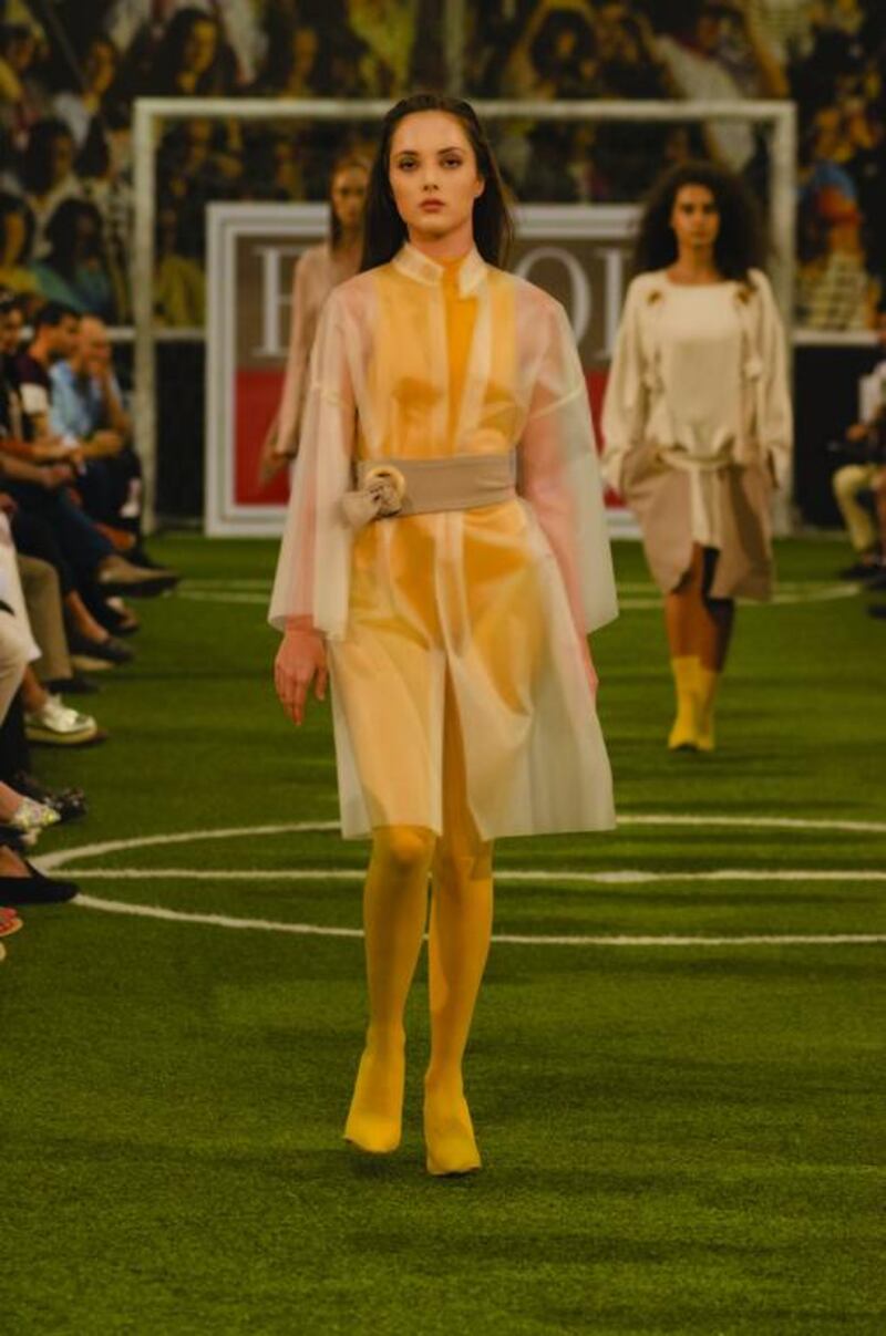 This sheer coat over a yellow bodysuit by Lana Qatramiz is sharp, neat and surprisingly wearable. Courtesy ESMOD