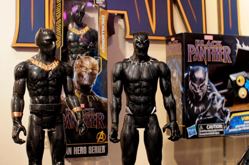 Black Panther toys are displayed to attendees at the Hasbro showroom during the annual New York Toy Fair, on February 20, 2018, in New York. 
Panther claws, masks and action figures are leaping off store shelves after runaway hit "Black Panther" -- the first film in the Marvel universe focused on a black superhero -- shredded box office expectations with a massive opening weekend. Toys and accessories linked to the movie, which is also making waves for its strong black female leading roles, have the potential to become an enduring presence in stores, like Spider-Man and other iconic figures, company executives say. Toy tie-ins remain a crucial profit driver for movie studios, even if each merchandise opportunity is not massively successful, experts say. 
 / AFP PHOTO / EDUARDO MUNOZ ALVAREZ / TO GO WITH AFP STORY by John BIERS, "'Black Panther' toy sales fierce as film opens big"