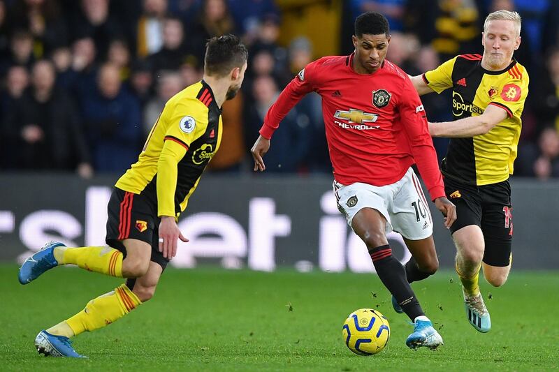 Manchester United striker Marcus Rashford (C) vies with Watford's Spanish defender Kiko Femenia. AFP