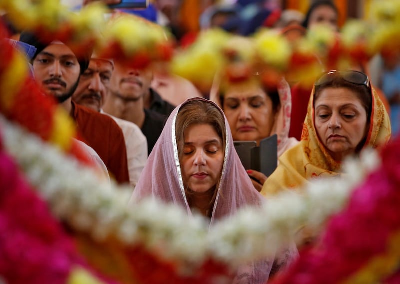 Devotees offer prayers inside a Sikh temple to mark the 550th birth anniversary of Guru Nanak Dev, the first Sikh Guru and founder of Sikh faith, in Chennai, India, November 12, 2019. Reuters