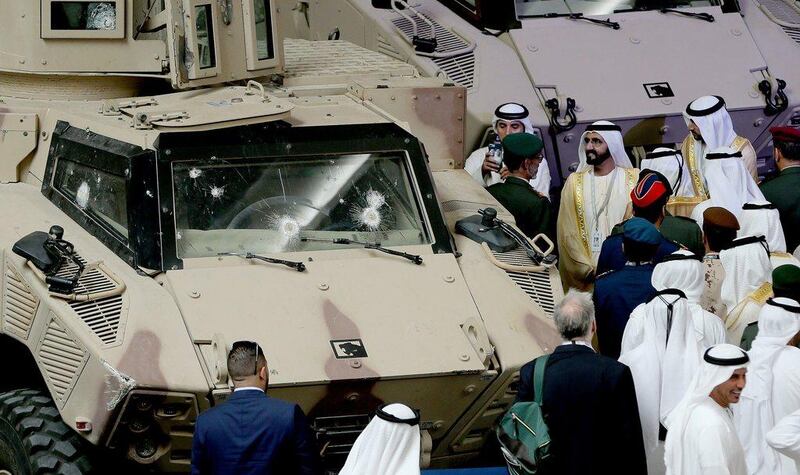Sheikh Mohammed bin Rashid, Vice President and Prime Minister of the UAE and Ruler of Dubai, views armoured vehicles on the first day of the International Defence Exhibition and Conference in Abu Dhabi. EPA
