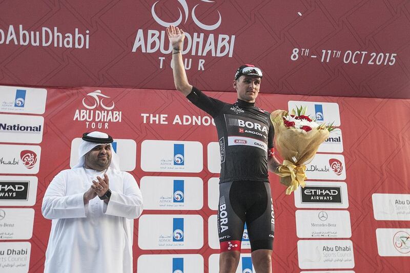 Paul Voss of the Bora-Argon 18 team celebrates on the podium with the black jersey for winning the intermediate sprint classification on Thursday at the Abu Dhabi Tour. Mona Al Marzooqi / The National
