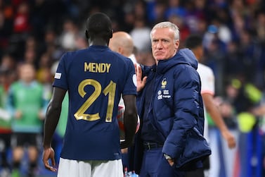 France's head coach Didier Deschamps (R) gestures to France's defender Ferland Mendy during the UEFA Nations League, League A Group 1 football match between France and Austria at Stade de France in Saint-Denis, north of Paris, on September 22, 2022.  (Photo by FRANCK FIFE  /  AFP)