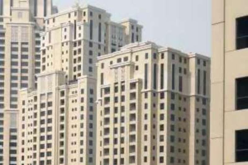 DUBAI, UNITED ARAB EMIRATES - JULY 19:  Paul Rodgers (not pictured), a building engineer, feels that the structures in the Jumeirah Beach Residence (JBR) are basically unsafe. This is the view of JBR (seen on the right-hand side) taken from his home in Rimal 4 in Dubai on July 19, 2009.  (Randi Sokoloff / The National)  For News story by Hugh Naylor *** Local Caption ***  RS016-071909-JBR.jpg