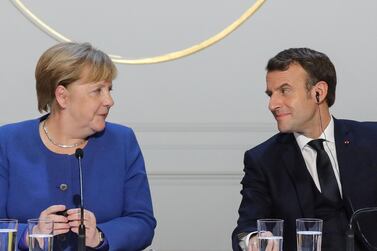 German Chancellor Angela Merkel and French President Emmanuel Macron give a news conference in December. Reuters
