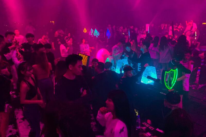 The crowded nightclubs in Wuhan are a stark contrast to a year ago, when the entire city was placed under strict lockdown on January 23, 2020. AFP