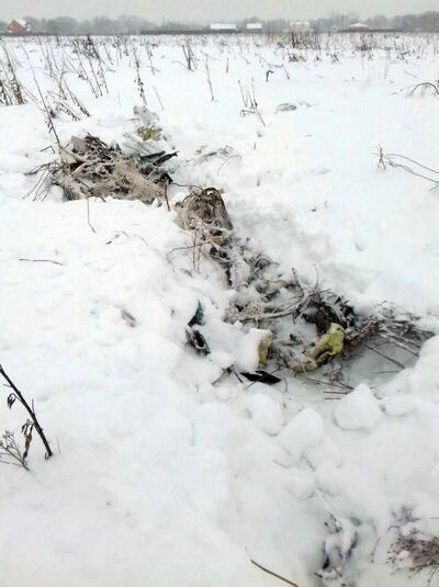 epa06517169 A picture made available on 12 February 2018 shows a debris of the crashed Russian Saratov Airlines Antonov AN-148 passenger plane lies in the snow near the Stepanovskoy village near Argunovo, Ramensky district, Moscow region, Russia, 11 February 2018. A Russian Antonov AN-148 crashed shortly after take off from Domodedovo airport outside Moscow. All 71 people aboard are believed to have died in the crash. The plane of Saratov airlines was en route from Moscow to Orsk, Orenburg region.  EPA/ALEXANDER OLEINIKOV BEST QUALITY AVAILABLE