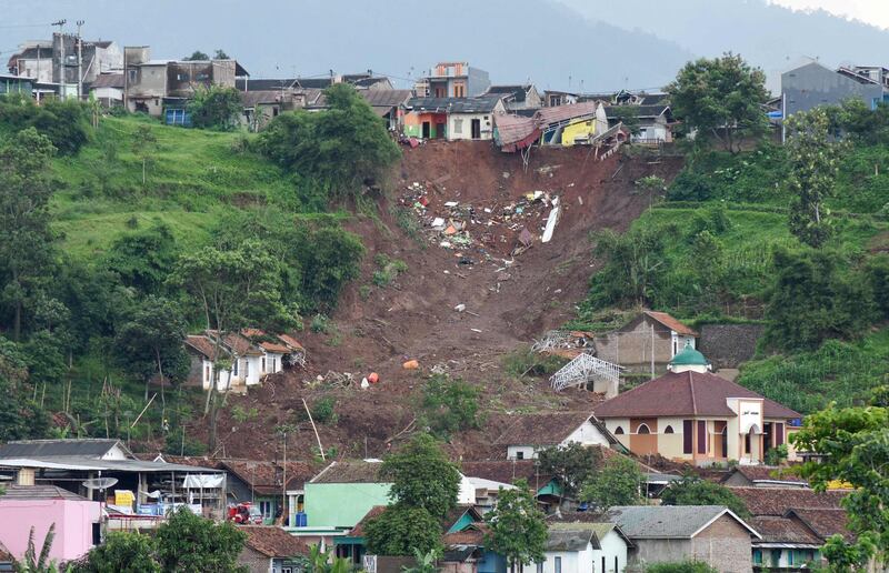 The aftermath of a landslide which swept away homes the day before, in Sumedang, West Java province, Indonesia. AFP