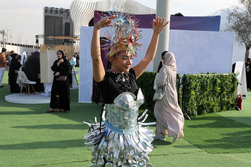 A performer wearing a dress made from recycled material at the Road to Cop28 launch event at Al Wasl Plaza, Expo City Dubai