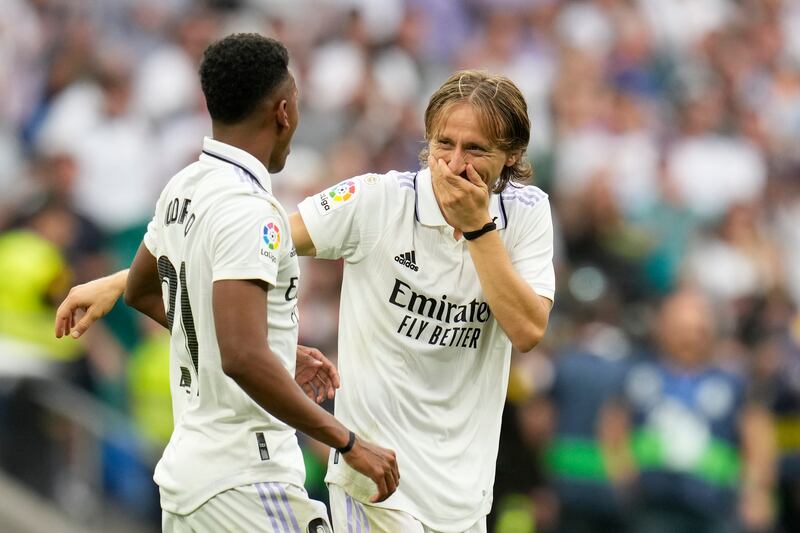 Real Madrid's Luka Modric embraces teammate Rodrygo at the end of the match. AP