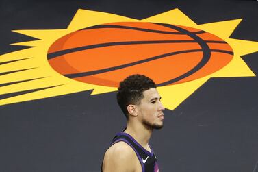 PHOENIX, ARIZONA - JUNE 28: A dejected Devin Booker #1 of the Phoenix Suns leaves the court following the team's loss to the LA Clippers during the second half in Game Five of the Western Conference Finals at Phoenix Suns Arena on June 28, 2021 in Phoenix, Arizona.  NOTE TO USER: User expressly acknowledges and agrees that, by downloading and or using this photograph, User is consenting to the terms and conditions of the Getty Images License Agreement.    Christian Petersen / Getty Images / AFP

