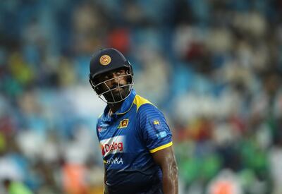 DUBAI, UNITED ARAB EMIRATES - OCTOBER 13:  Thisara Perera of Sri Lanka leave the field after being dismissed by Shadab Khan of Pakistan during the first One Day International match between Pakistan and Sri Lanka at Dubai International Stadium on October 13, 2017 in Dubai, United Arab Emirates.  (Photo by Francois Nel/Getty Images)