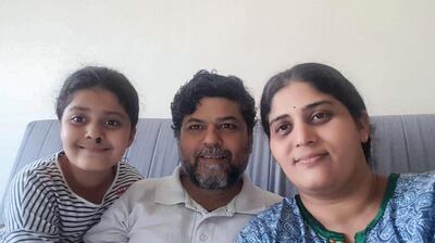 Pankaja Apte with her husband Akash and daughter Gargi were stranded in the UAE when international flights were shut down to control the spread of the coronavirus. The family is leaving on a flight chartered by the Gulf Maharashtra Business Forum that has worked with community volunteers to prioritise people who lost their jobs and need to return home. Courtesy: Apte family 