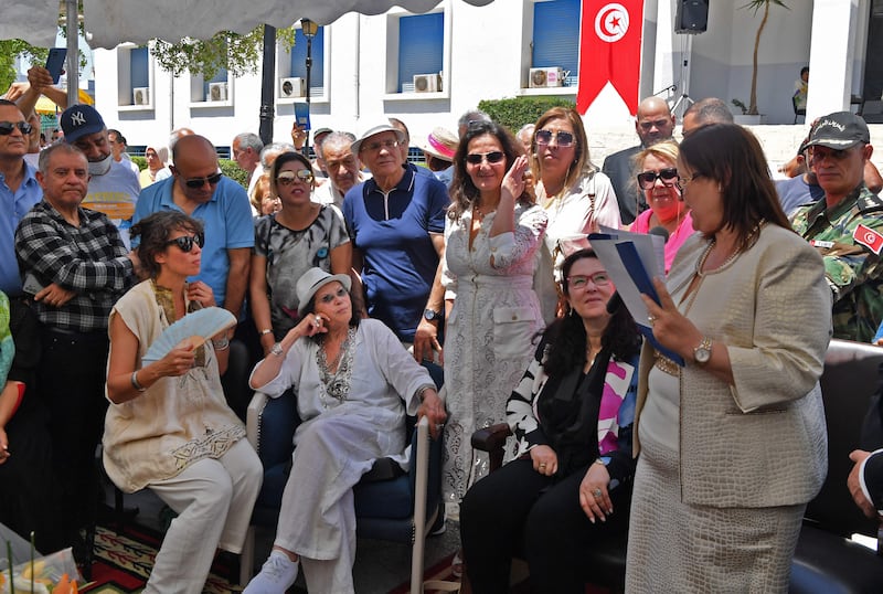 Claudia Cardinale, centre, listens to a speech by Amel Limam, right, Mayor of La Goulette, as she honours the actress.