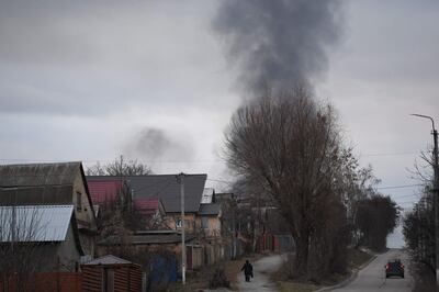 A column of smoke rises near the town of Hostomel and the Antonov airport, in north-west Kiev. AFP