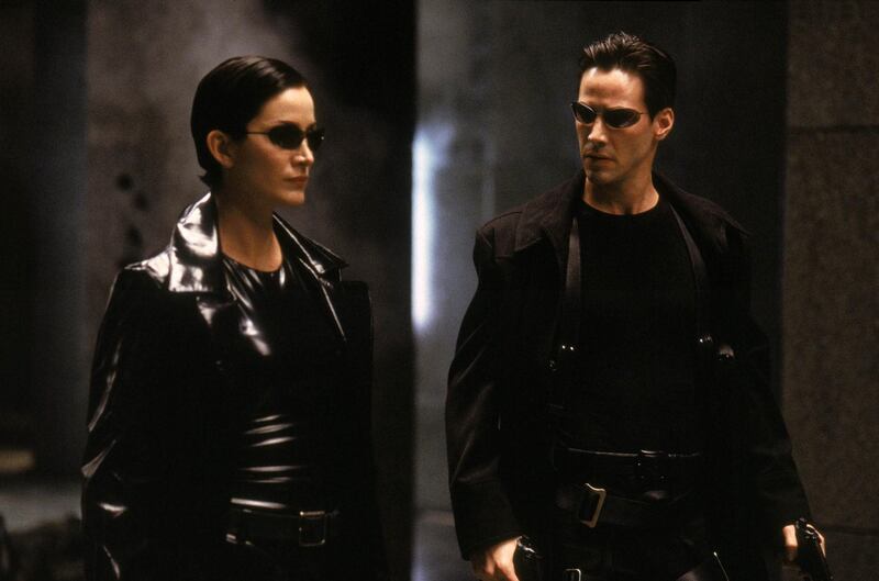 Carrie Anne-Moss annd Keanu Reeves in The Matrix. Courtesy Warner Bros.