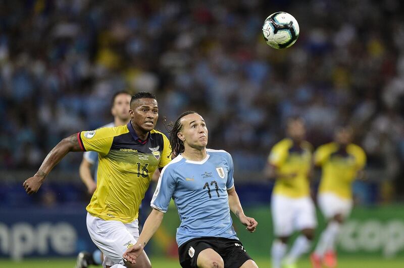 Diego Laxalt of Uruguay fights for the ball with Antonio Valencia of Ecuador during the Copa America Brazil 2019 group C match between Uruguay and Ecuador at Mineirao Stadium on June 16, 2019 in Belo Horizonte, Brazil. (Photo by Juliana Flister/Getty Images)