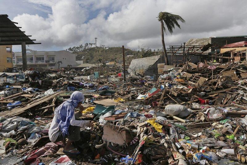 A survivor eats a banana which found in garbage heap in typhoon ravaged Tacloban city after typhoon Haiyan slammed into central Philippine, leaving a wide swath of destruction and thousands of people dead. Vincent Yu / AP Photo