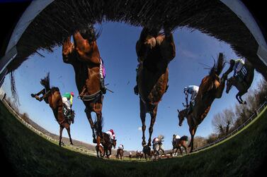 Runners and riders clear a fence during the Johnny Henderson Grand Annual Challenge Cup Handicap Chase on day two of the Cheltenham Festival at Cheltenham Racecourse. Picture date: Wednesday March 17, 2021. PA Photo. See PA Story RACING Cheltenham. Photo credit should read: David Davies/PA Wire for the Jockey Club. RESTRICTIONS: Editorial Use only, commercial use is subject to prior permission from The Jockey Club/Cheltenham Racecourse.
