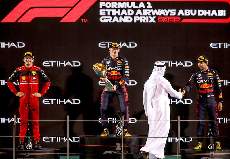 Max Verstappen on the podium with Charles Leclerc and Sergio Perez