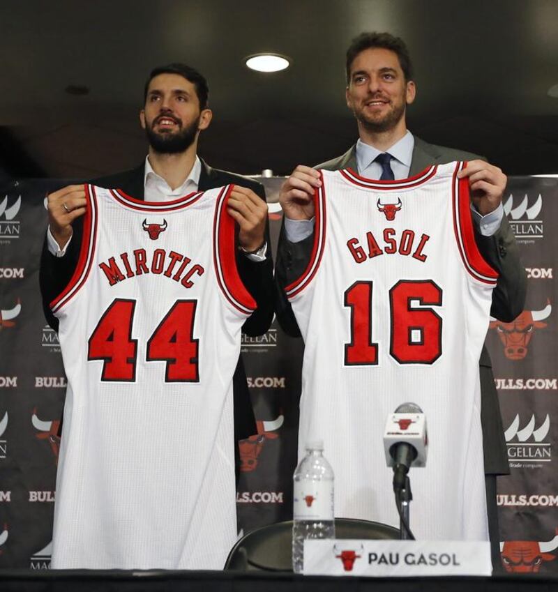 Nikola Mirotic, left, is presented by the Chicago Bulls alongside Pau Gasol in July 2014. Kamil Krzaczynski / EPA