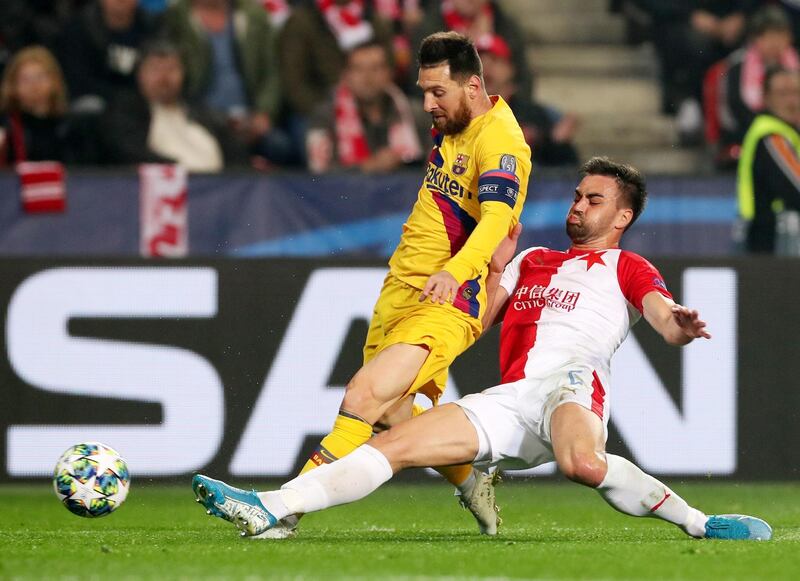 Lionel Messi is challenged by SK Slavia Prague's David Hovorka. EPA