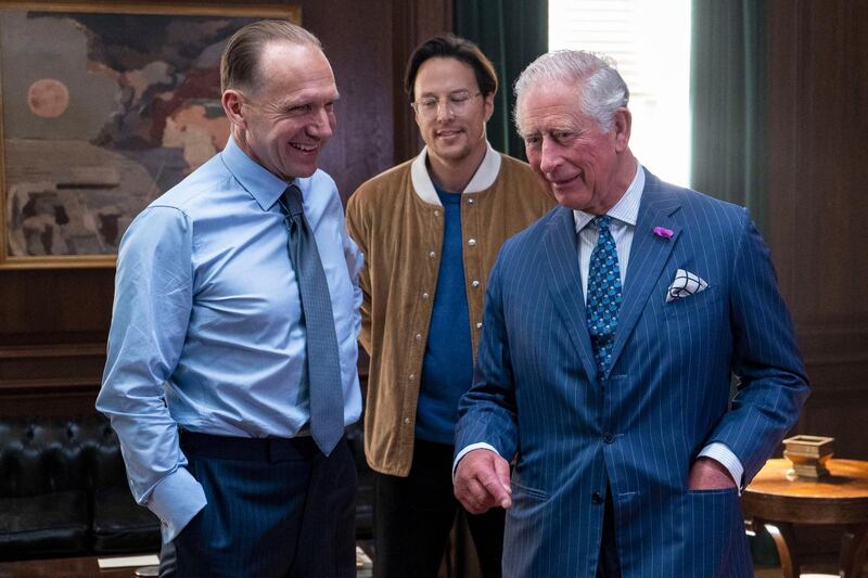 With actor Ralph Fiennes (left) and director Cary Joji Fukunaga (centre) on the set at Pinewood Studios in Iver Heath. Prince Charles is the patron of The British Film Institute and Royal Patron of the British Intelligence Services. Getty Images