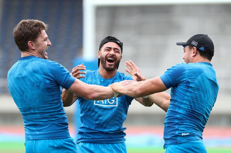 From left to right: New Zealand's Beauden Barrett, Richi Mo’unga and Anton Lienert-Brown share a joke during training. AFP