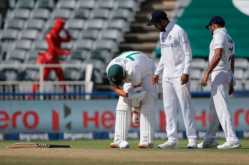 Mohammed Shami, right, and KL Rahul check on South Africa's Duanne Olivier after he was hit on the arm. AFP