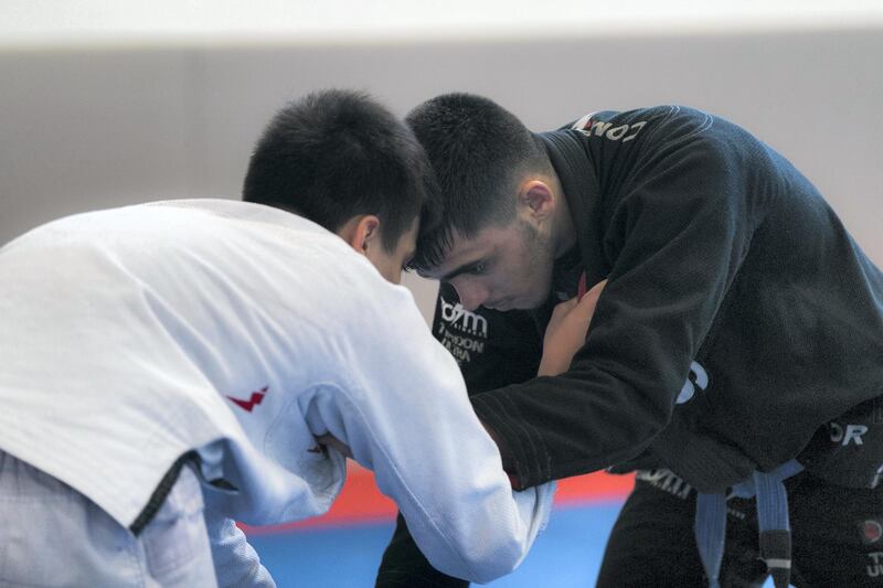 ABU DHABI, UNITED ARAB EMIRATES - AUGUST 14, 2018. 

Omar Al Fadhli, in black, of the UAE Jiu Jitsu national team, trains for the Asian Games 2018.

(Photo by Reem Mohammed/The National)

Reporter: AMITH PASSATH
Section:  SP