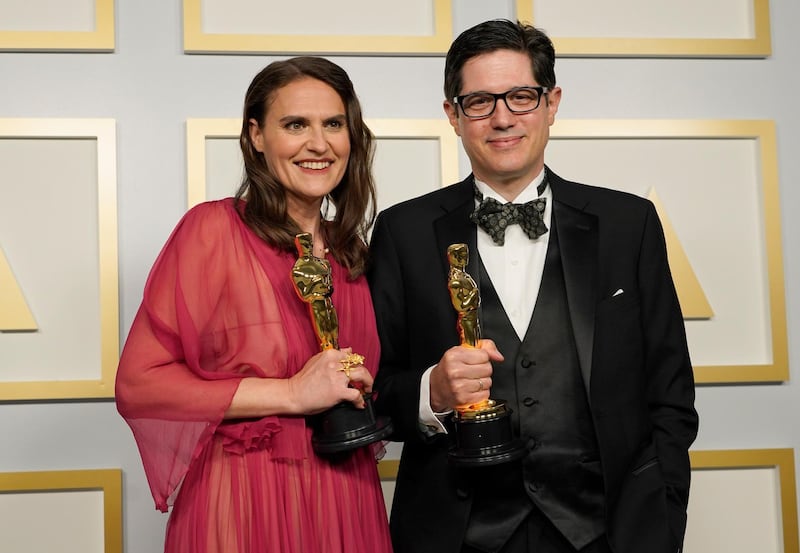 Best Documentary Short: Alice Doyard and Anthony Giacchino, for 'Colette', pose in the press room at the Oscars on Sunday, April 25, 2021, at Union Station in Los Angeles. Reuters
