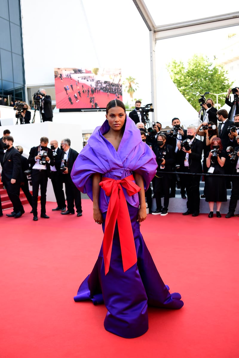 Tina Kunakey, in Valentino, attends the screening of 'Benedetta' during the 74th annual Cannes Film Festival on July 9, 2021.