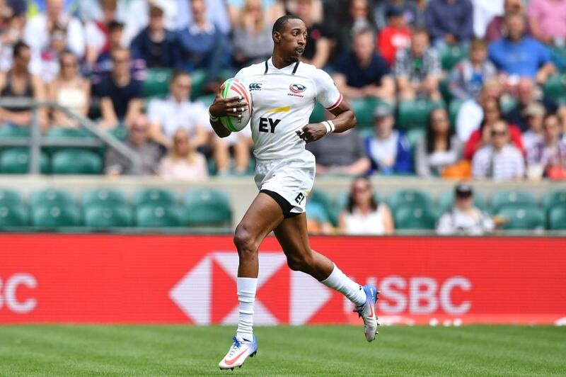 USA's Perry Baker runs in a try during the rugby union quarter-finals match between Canada and USA on the second day of the London 2019 World Rugby Sevens Series event at Twickenham Stadium in west London on May 26, 2019. (Photo by Ben STANSALL / AFP)