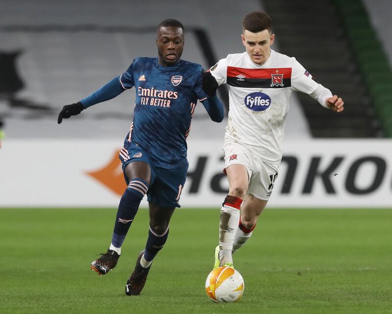 Arsenal's Nicolas Pepe in action with Darragh Leahy of Dundalk. Reuters