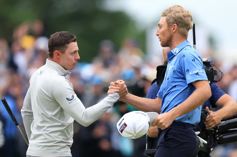 Matt Fitzpatrick and Will Zalatoris shake hands after completing the final round. Englishman Fitzpatrick carded a six-under 68 to win by a single shot. Reuters