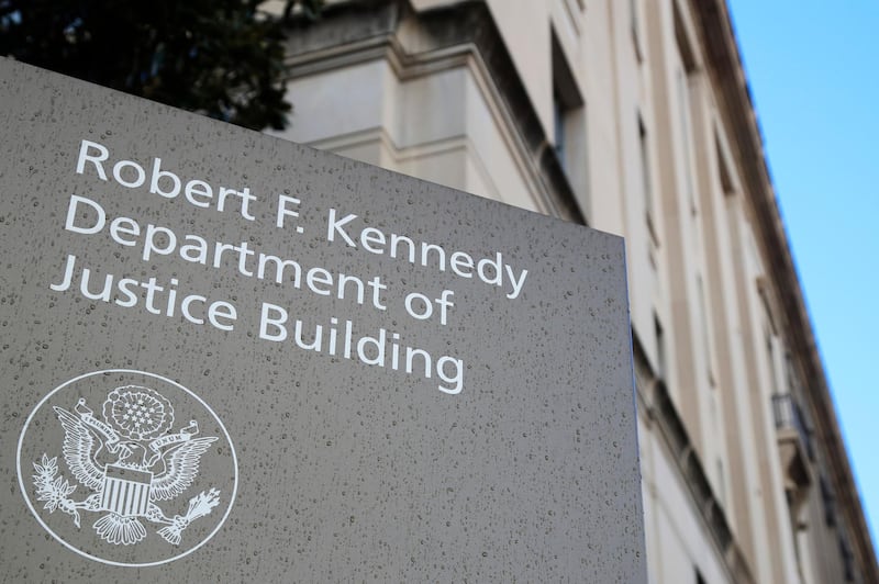 FILE - This Friday, March 22, 2019, file photo shows the Department of Justice Building in Washington. The U.S. Department of Justice is opening a sweeping antitrust investigation of major technology companies and whether their online platforms have hurt competition, suppressed innovation or otherwise harmed consumers. (AP Photo/Manuel Balce Ceneta, File)