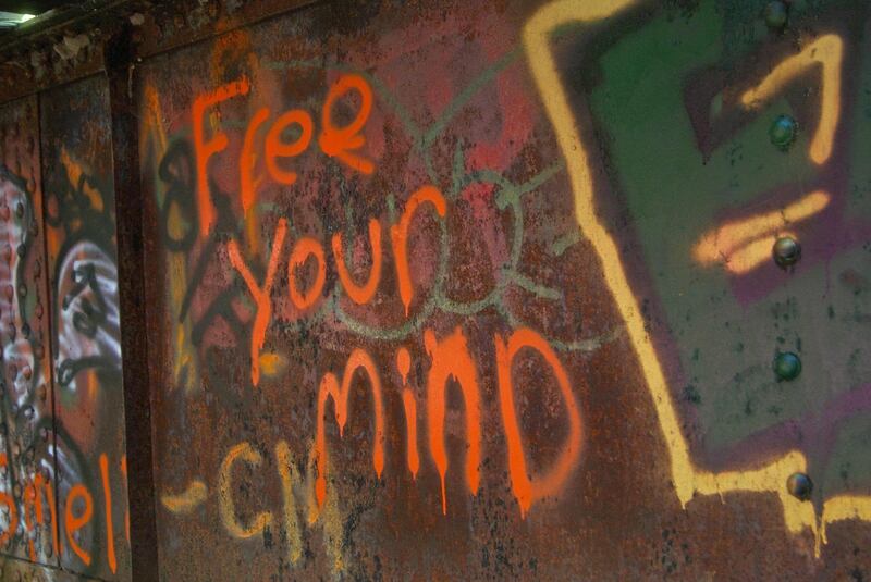 HPKR81 Free Your Mind graffiti on an old railway bridge. Alamy