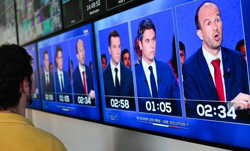 RN party president Jordan Bardella, third right, and France's Prime Minister Gabriel Attal, second right, taking part in a televised debate ahead of France's snap elections. AFP