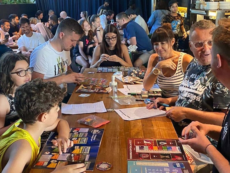 Collectors including Simon Smedley (right), gather in Dubai for a swap shop, where they exchange football World Cup stickers. Photo: Simon Smedley